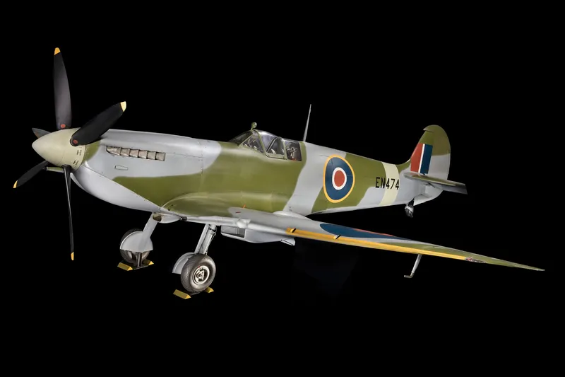 A Spitfire on display, photographed against a black background